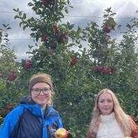 students showing apples